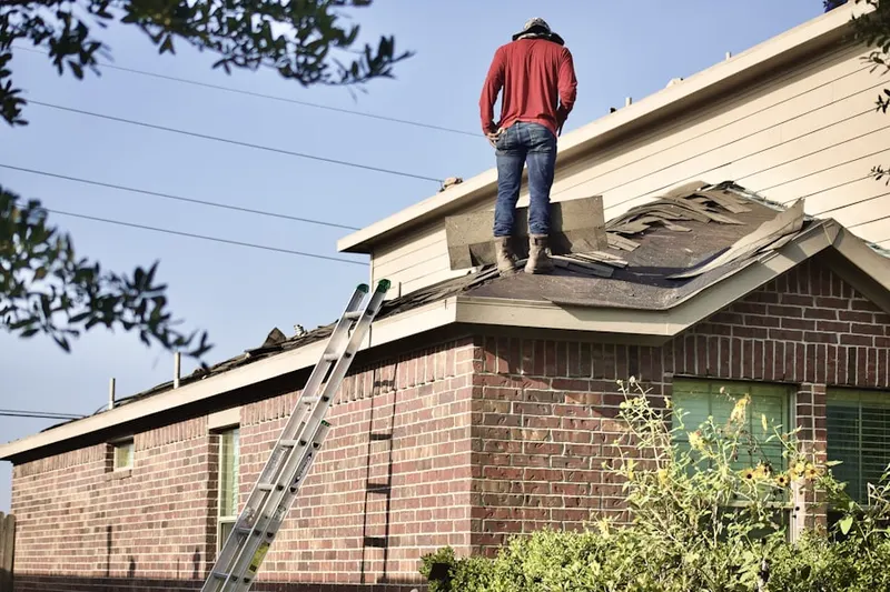 Professional roofer working on a residential roof in Rancho La Paz